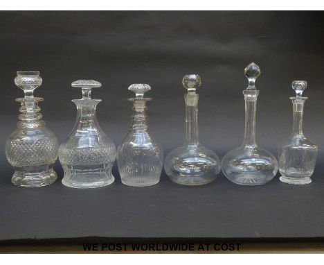 Six various clear cut glass decanters including a Scottish thistle decanter, small Georgian decanters etc. 