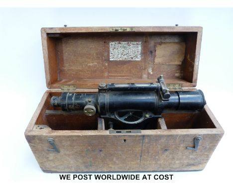 A cased E.R. Watts & Son surveyor's level with compass below scope