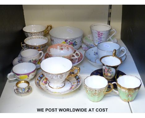 A collection of cups and saucers to include Derby, Vienna & Meissen, an unmarked miniature cup and saucer etc 
