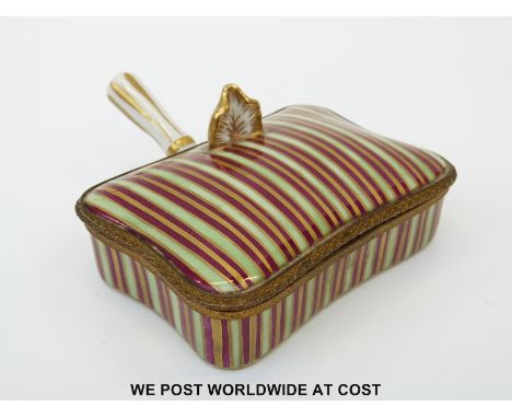 A French ceramic sweetmeat serving box with hinged lid and handle decorated in green, red and gilt and French script to base 