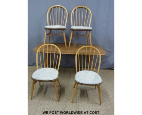 An Ercol light elm dining table (H72 x W155 x W76cm) and four dining chairs 