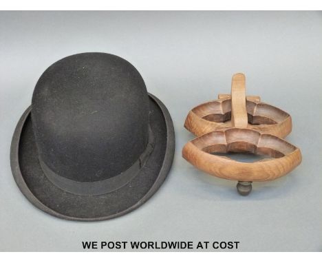 Bowler hat and a carved wooden door knocker