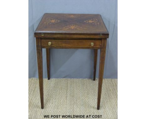 A 19th/20th century inlaid rosewood games table with single drawer and action to lift the first quarter flap, the interior wi