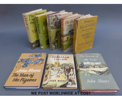 A selection of first editions by John Moore. Titles include Man and Bird and Beast; The Season of the Year; The Waters Under 