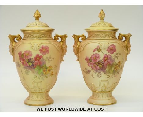 Royal Worcester pair of pedestal lidded vases with twin mask handles decorated with flowers, both with puce marks and shape n
