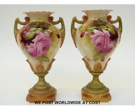 Royal Worcester pair of twin handled pedestal vases hand decorated with roses, puce Worcester mark and shape no 1959 to bases