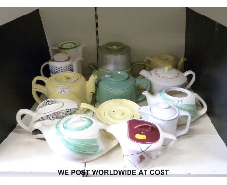 A collection of Art Deco and retro teapots, some with hot water bases including Poole, hand painted Shorter and Meakin Horizo