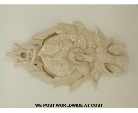 A rare ceramic wall pocket in the form of a hummingbird and nest, impressed W H Goss to reverse with early Gosshawk mark (28c