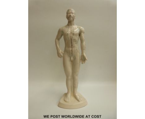 A ceramic acupuncture figure, overall length 46cm, height 51cm