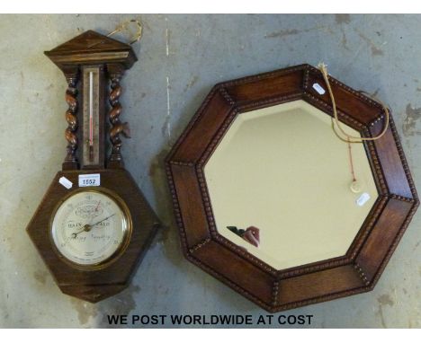 A Short & Mason barometer/thermometer together with an oak framed octagonal mirror
