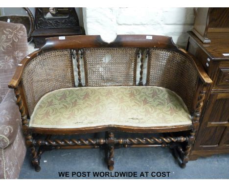 An Edwardian serpentine-fronted bergere drawing room sofa (W95cm x D46cm)