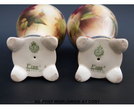 Royal Worcester pair of vases hand-decorated with roses, signed Austin (17cm tall)
