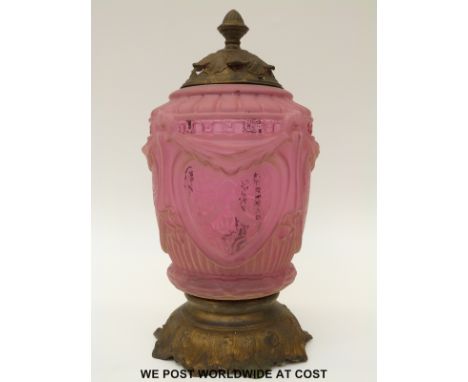 An Art Nouveau moulded and etched cranberry glass and gilt metal lamp, 39cm tall. 