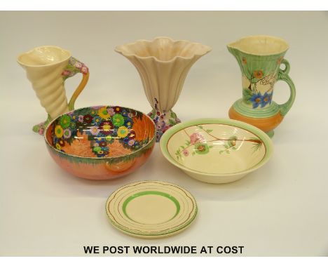 A small collection of Clarice Cliff including two vases and a bowl, an Art Deco Beswick ware jug and a Carltonware lustre bow