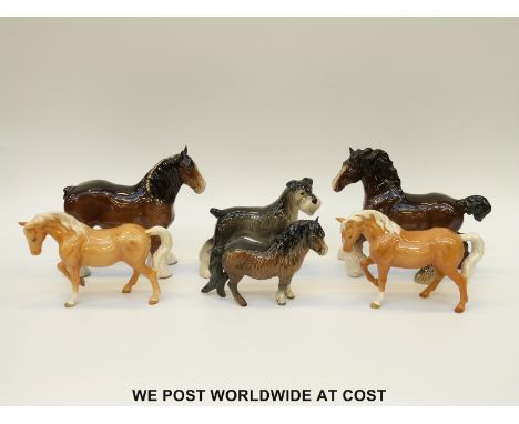 Five Beswick horses including two Palominos cantering, standing Shire, Shetland pony and a Melba Ware dog. 