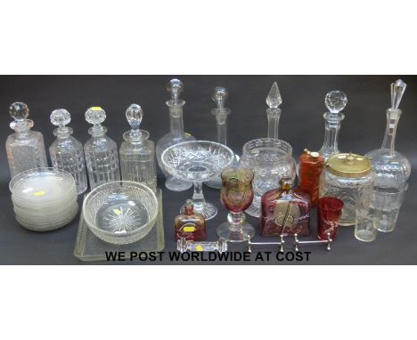 A collection of glass including ship's decanter, coloured glass, decanter stoppers, iridescent glass vase etc