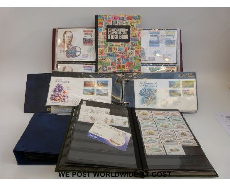 Three albums of St Vincent first day covers and a stockbook of mainly St Vincent QEII stamps