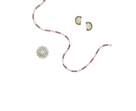 A gold, ruby and diamond line necklace mounted in 18k gold; estimated total diamond weight: 9.05cts; gross weight approximate