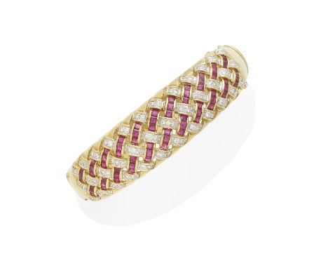 A gold, Ruby and Diamond basket weave bracelet mounted in 18k gold; estimated total diamond weight: 1.05cts; gross weight app