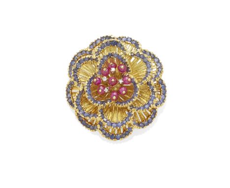 a ruby, sapphire and diamond flower brooch, Tolirocentering nine ruby beads and encircled by sapphires; mounted in 18k gold; 
