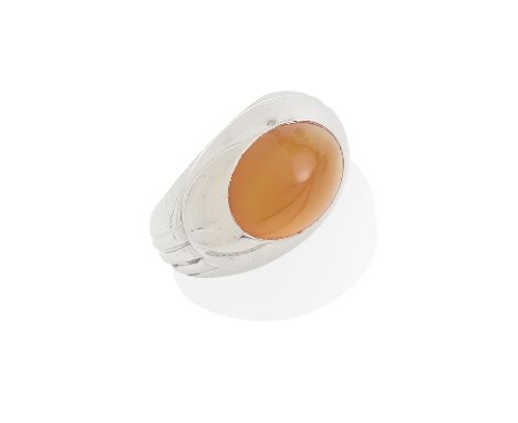 A white gold and carnelian ring, Boucheroncentering an oval shaped sugarloaf-cut carnelian weighing approximately 9.60cts; mo