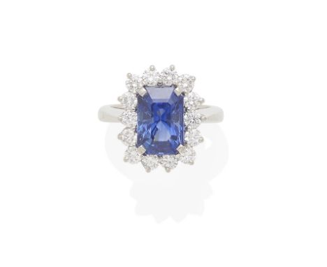 A SAPPHIRE AND DIAMOND RING mounted in platinum; estimated total diamond weight: 1.40cts; size: 6 1/2