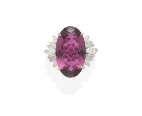 a rubellite and diamond ringcentering an oval-cut rubellite tourmaline weighing approximately 9.90cts; mounted in platinum; s