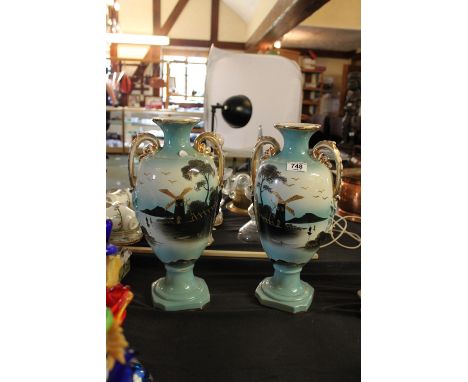 Pair of H.J.England ceramic twin handled vases with windmill detail on blue ground, H - 41cm
