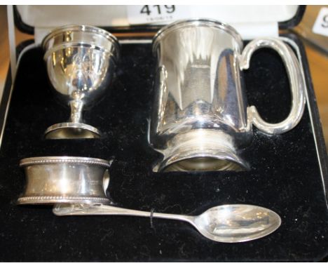 Boxed silver child's set, egg cup mug, spoon and napkin ring, 100g