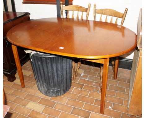 Light oak oval extending dining table with two dining chairs, 143 x 93cm