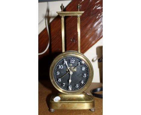 Gravity shelf brass clock, c1920s