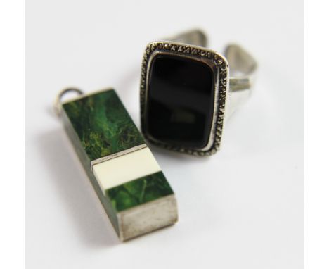 Malachite pendant in silver and a black stone ring on silver band