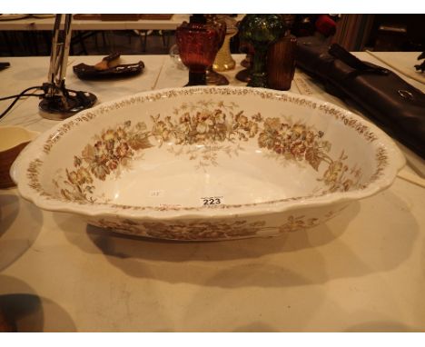 Large ceramic oval bowl decorated with flowers, marked Pauldon place, England, reg no 135305