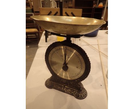 Set of cast iron Salter family scales with brass pan