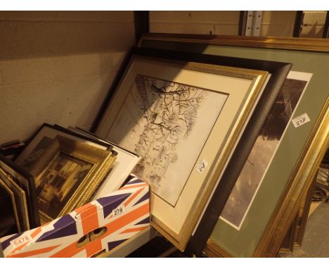 Shelf of mixed pictures, paintings and photographs