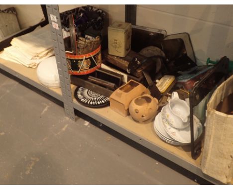 Two shelves of mixed items including mirror, picture, collectors tins, electric sander, scales, ceramics etc 