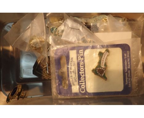 Box of tin and enamel badges