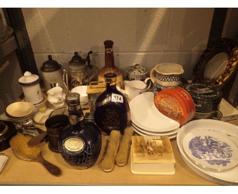 Shelf of mixed items including clock, dimple bottle, Bells whisky bell, steins, mirror etc