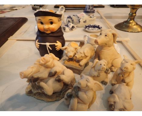 Piggin pigs collection of seven, Goebel Monk Toby jug and a Widdecombe pottery Uncle Tom Cobbleigh jug 
