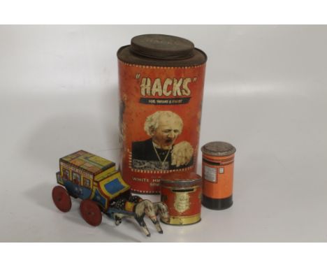 A VINTAGE TIN PLATE WIND - UP STAGE COACH TOY, together with two money boxes and a vintage 'Hacks' tin jar. 