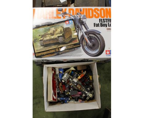 A BOXED UNMADE TAMIYA 1/6 SCALE HARLEY DAVIDSON FLSTFB FAT BOY LO MOTORCYCLE, together with a boxed unmade Tamiya 1/48 scale 