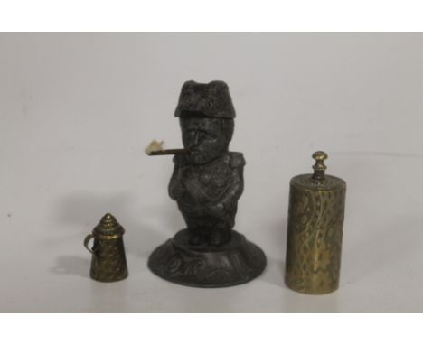 A 19TH CENTURY FIGURAL TABLE LIGHTER IN THE FORM OF A MILITARY OFFICER WITH BRASS CIGAR. Along with brass 'Dowlers Nocturnal 