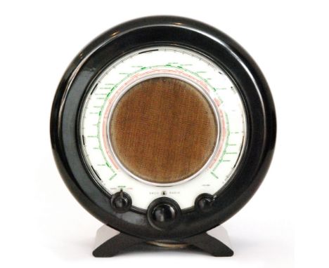 Wells Coates - E.K Cole Ltd (Ekco) - A post-war brown Bakelite radio, model A22 of circular form with a circular dial central