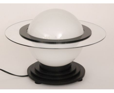 Unknown - A table lamp in the Art Deco style, with an opaque glass shade above a stepped black base, height 25cm.