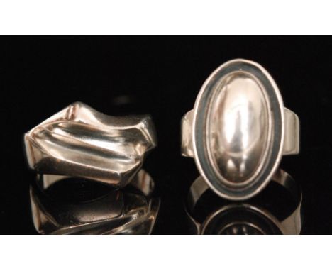 Nils Erik From - A 1960s Danish Sterling silver oval ring with cabochon silver centre and another of modernist abstract desig