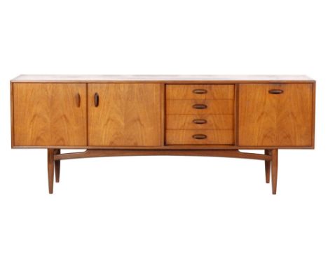 G-Plan - A teak sideboard, model number 4058, fitted with an arrangement of four central drawers, a single and a double cupbo