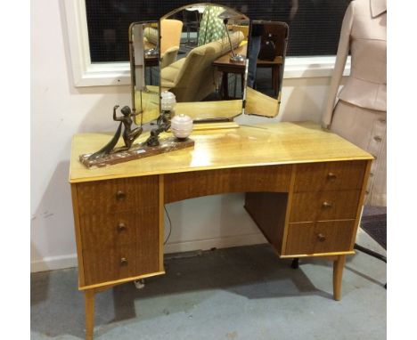 Attributed to Gimson and Slater Ltd - A 'Vesper' eucalyptus veneered dressing table, with triple mirror over an arrangement o