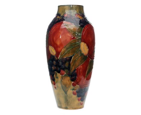 William Moorcroft - A vase of shouldered ovoid form decorated in the Pomegranate pattern with a band of fruit and foliage ove