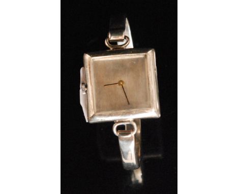 Old England Watches Ltd - A 1970s hallmarked silver manual wind bangle watch, the square silvered dial within Sterling silver