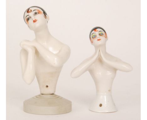 Unknown - Two 1920s Art Deco Pierrot half doll pin cushions, the first with her arms clasped and her head titled to her left,
